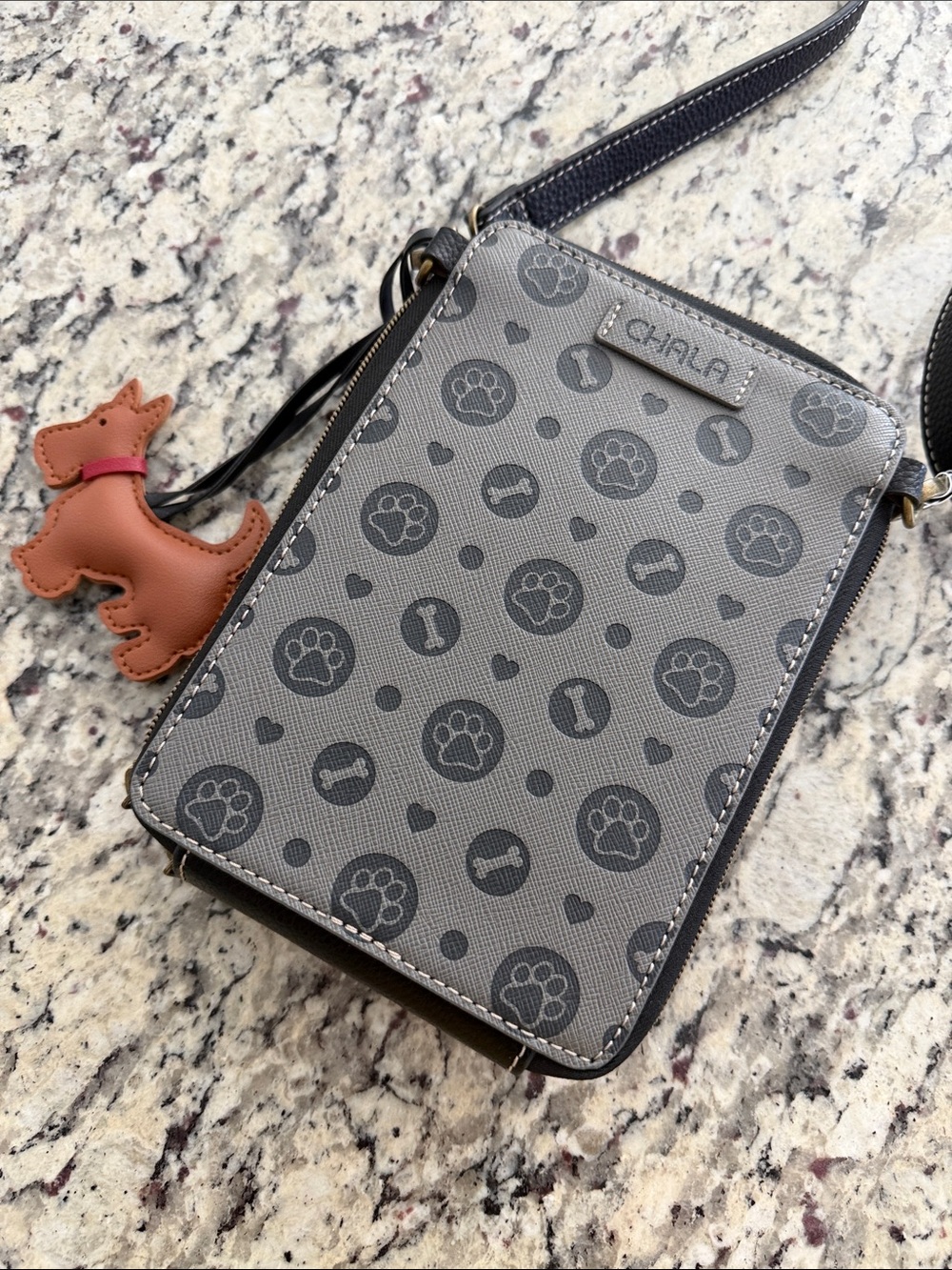 Chala Snap Crossbody bag features a whimsical, embossed paw print - Picture 3 of 5